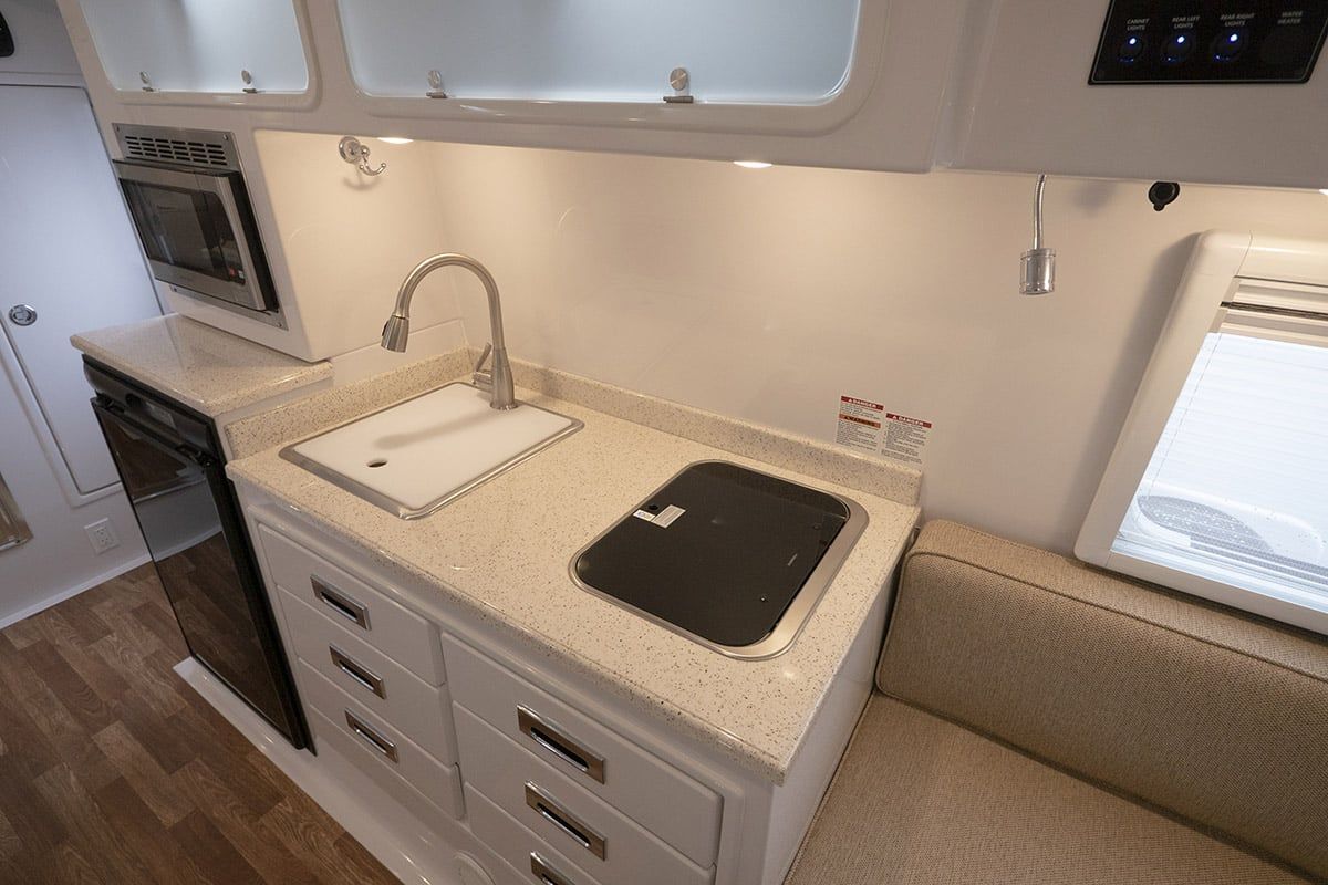 Light FiberGranite countertop with a sink and cooktop cover