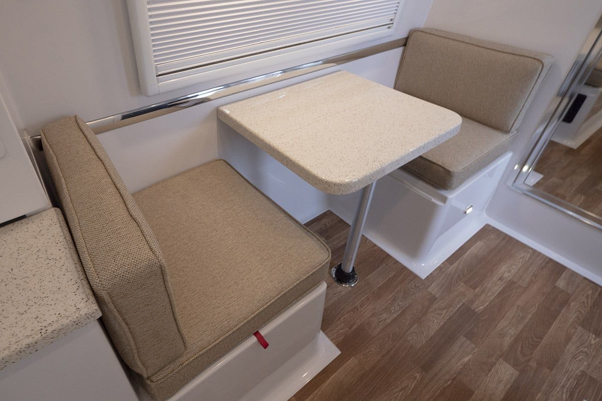 Light FiberGranite dinette table between two bench seats